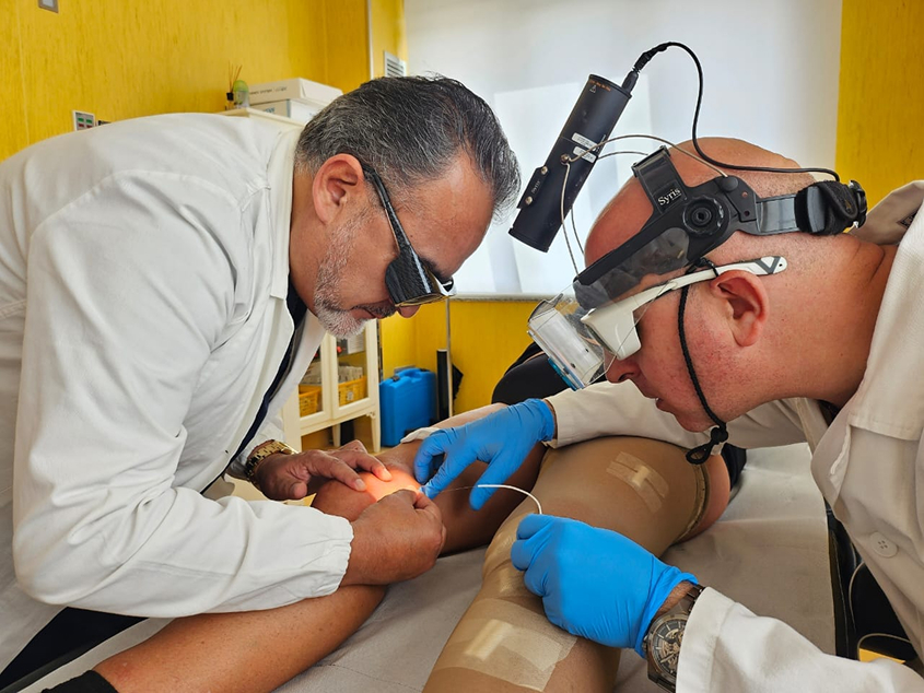 Dr. Arias performing a phlebology procedure